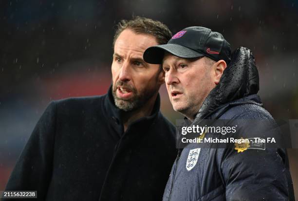 Gareth Southgate, Manager of England men's senior team, and Steve Holland, Assistant Manager of England, look on during the international friendly...