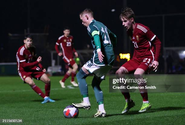 Cole Brannigan of Northern Ireland is challenged by Botond Szeker of Hungary during the Under-17 EURO Elite Round match between Hungary and Northern...