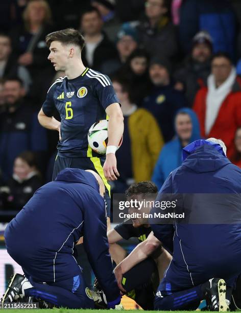 Scotland captain Andy Robertson sits on the pitch injured during the international friendly match between Scotland and Northern Ireland at Hampden...