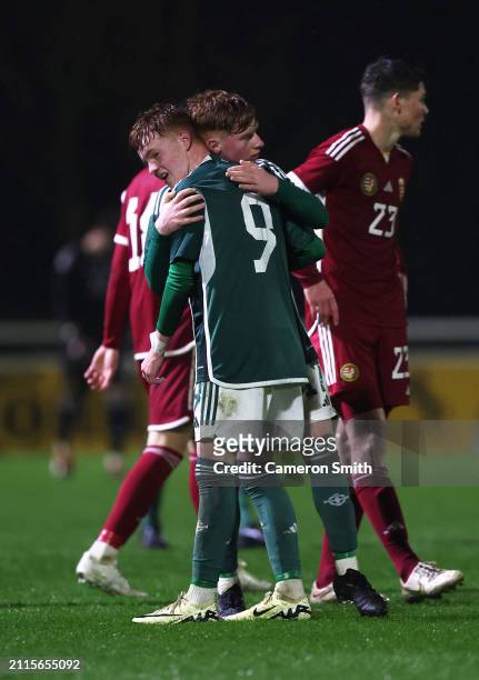 Alexander Watson embraces Braiden Graham of Northern Ireland following the Under-17 EURO Elite Round match between Hungary and Northern Ireland at St...