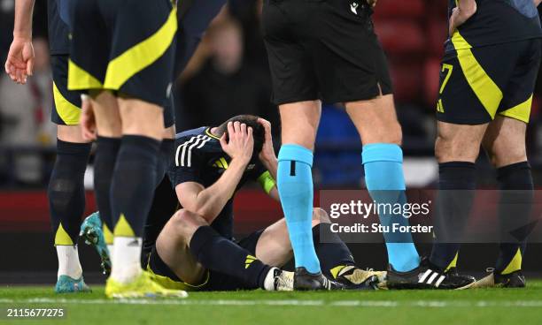 Scotland captain Andrew Robertson reacts after picking up an injury and subsequently being substituted during the international friendly match...