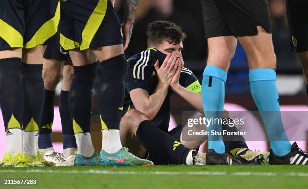 Scotland captain Andrew Robertson reacts after picking up an injury and subsequently being substituted during the international friendly match...