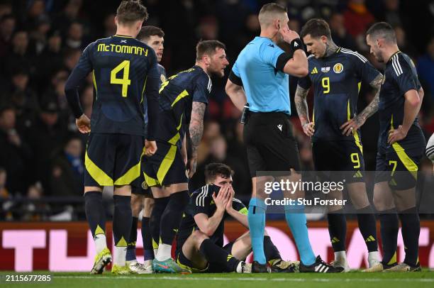 Scotland captain Andrew Robertson reacts after picking up an injury and subsequently being substituted during the international friendly match...