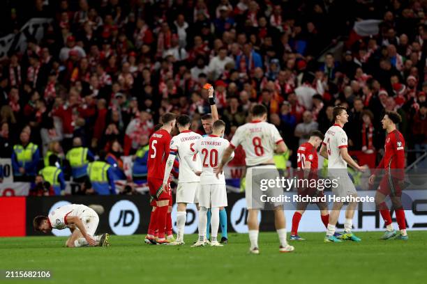 Chris Mepham of Wales is shown a red card by Referee Daniele Orsato during the UEFA EURO 2024 Play-Offs Final match between Wales and Poland at...