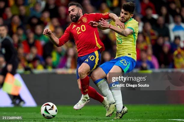 Daniel Carvajal of Spain battle for the ball with Lucas Beraldo of Brazil penalty during the friendly match between Spain and Brazil at Estadio...