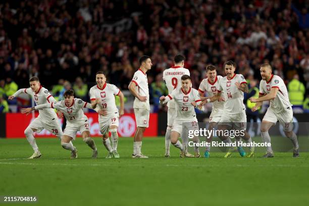 The players of Poland celebrate after victory in the penalty shoot out during the UEFA EURO 2024 Play-Offs Final match between Wales and Poland at...