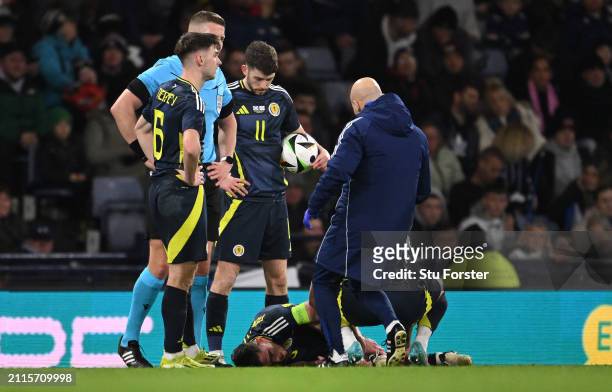 Scotland captain Andrew Robertson reacts after picking up an injury and subsequently being substituted during the international friendly match...