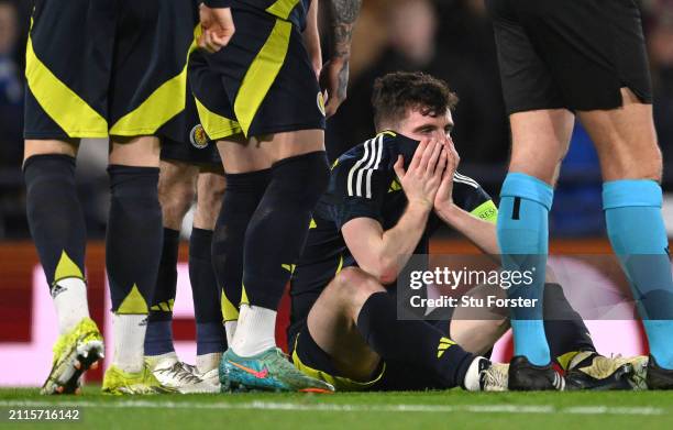 Scotland captain Andrew Robertson reacts after picking up an injury and subsequently being substituted during the international friendly match...