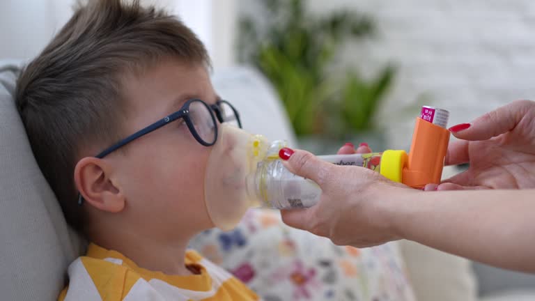 Child Using An Inhaler 23 Asthma Inhaler And Spacer Stock Videos, Footage, & 4K Video Clips ...