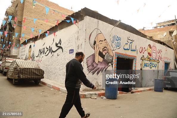 Egyptian graffiti artists show solidarity with Gaza under Israeli attacks through their murals