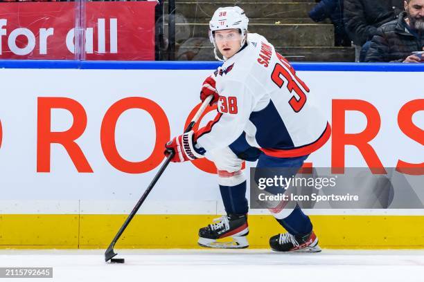 Washington Capitals Defenceman Rasmus Sandin skates with the puck during the NHL regular season game between the Washington Capitals and the Toronto...