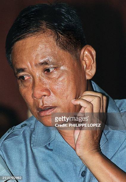 Cambodian Khmer Rouge former commander Nuon Paet stands in the Phnom Penh court, 20 September 2000 as he's waiting for the begining of the his appeal...