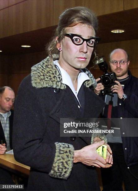 Samir Fansa , dressed up as a woman, enters Bielefeld's district court, 21 December 2000. Fansa is charged with grievous bodily harm after he flung a...