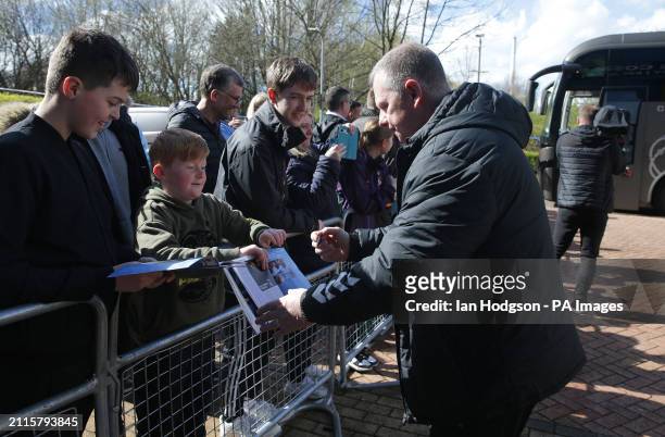 Coventry City manager Mark Robins signs autographs for fans before the Sky Bet Championship match at the John Smith's Stadium, Huddersfield. Picture...