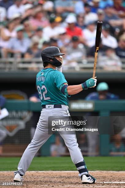 Cole Young of the Seattle Mariners bats during the eighth inning of a spring training game against the Oakland Athletics at Hohokam Stadium on March...