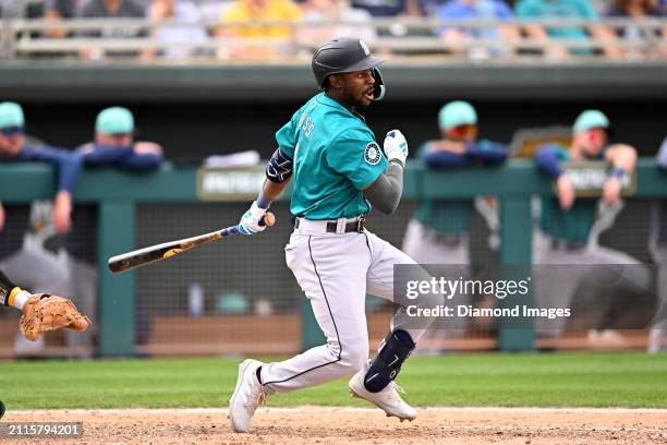 Ryan Bliss of the Seattle Mariners bats during the seventh inning of a spring training game against the Oakland Athletics at Hohokam Stadium on March...