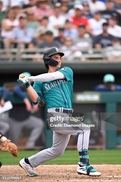 Cole Young of the Seattle Mariners bats during the eighth inning of a spring training game against the Oakland Athletics at Hohokam Stadium on March...