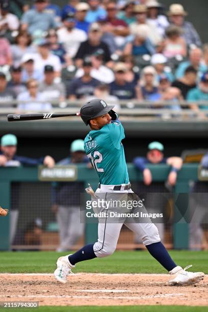 Harry Ford of the Seattle Mariners bats during the eighth inning of a spring training game against the Oakland Athletics at Hohokam Stadium on March...