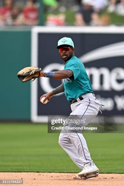 Ryan Bliss of the Seattle Mariners warms up during the seventh inning of a spring training game against the Oakland Athletics at Hohokam Stadium on...