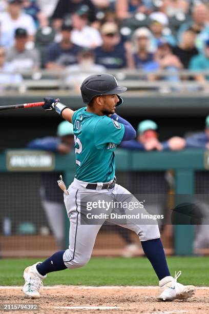 Harry Ford of the Seattle Mariners bats during the eighth inning of a spring training game against the Oakland Athletics at Hohokam Stadium on March...