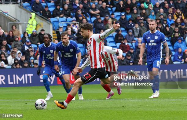 Adil Aouchiche of Sunderland scoring the opening goal from the penalty spot during the Sky Bet Championship match between Cardiff City and Sunderland...