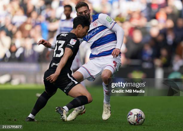 Sam Field of Queens Park Rangers under pressure from Paik Seung-Ho of Birmingham City during the Sky Bet Championship match between Queens Park...