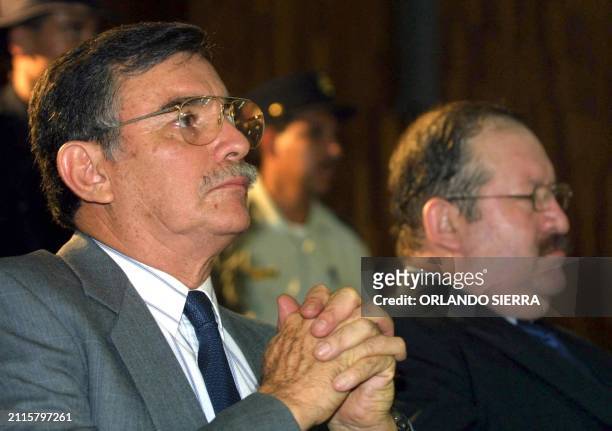The ex chief of the Estado Mayor Presidencial, general Agusto Godoy, and the Colonel Juan Guillermo Oliva listen, 3 October 2002, Guatemala City, the...