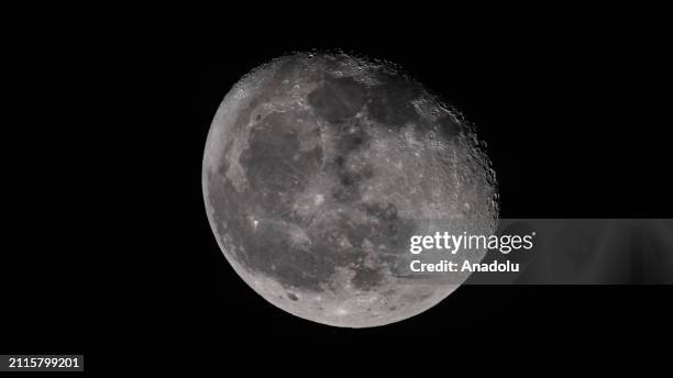 Moon appears over Kars, Turkiye on March 28, 2024. The Moon is currently in its 'Waning Gibbous' phase, marking the period after the full moon when...