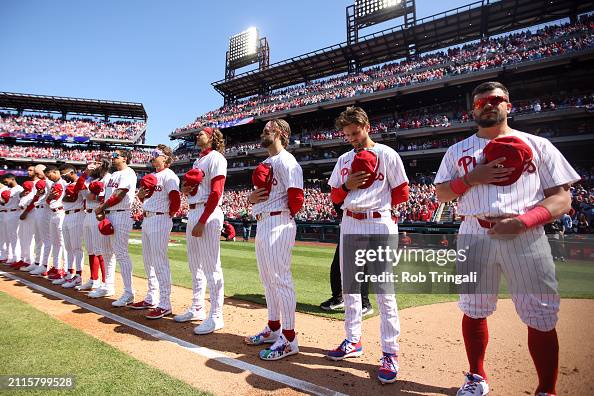 First Base Line Crowd The Philadelphia Phillies stand on the first base line during the ...