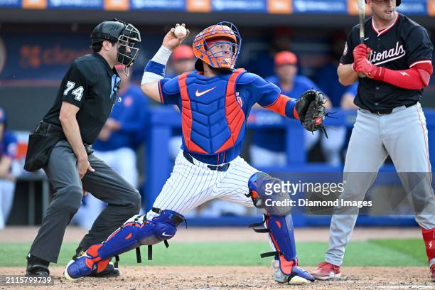 Francisco Alvarez of the New York Mets throws to second base during the second inning of a spring training game against the Washington Nationals at...