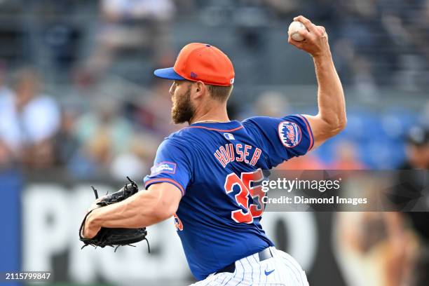 Adrian Houser of the New York Mets throws a pitch during the second inning of a spring training game against the Washington Nationals at Clover Park...