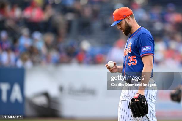 Adrian Houser of the New York Mets looks on during the second inning of a spring training game against the Washington Nationals at Clover Park on...