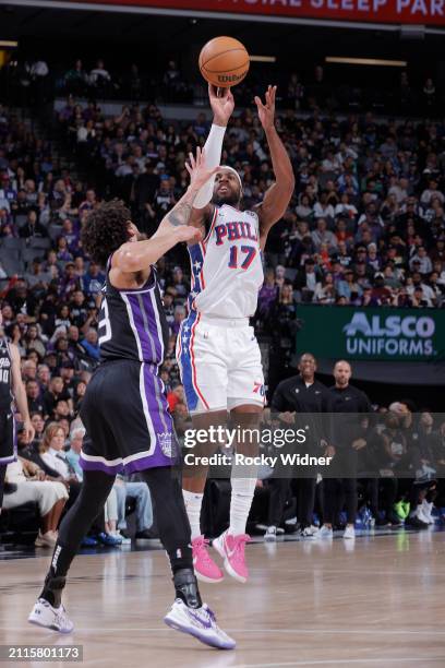 Buddy Hield of the Philadelphia 76ers shoots a three pointer during the game against the Sacramento Kings on March 25, 2024 at Golden 1 Center in...