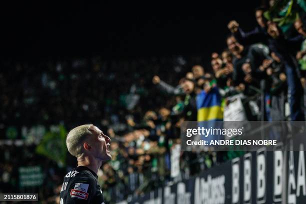 Sporting Lisbon's Portuguese midfielder Nuno Santos celebrates scoring his team's second goal during the Portuguese League football match between...