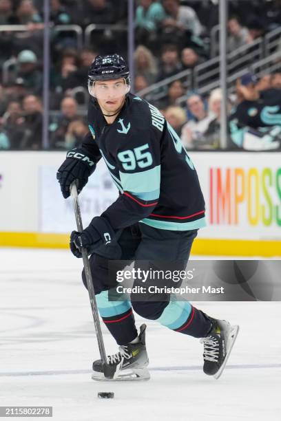 Andre Burakovsky of the Seattle Kraken skates with the puck during the third period of a game against the Anaheim Ducks at Climate Pledge Arena on...