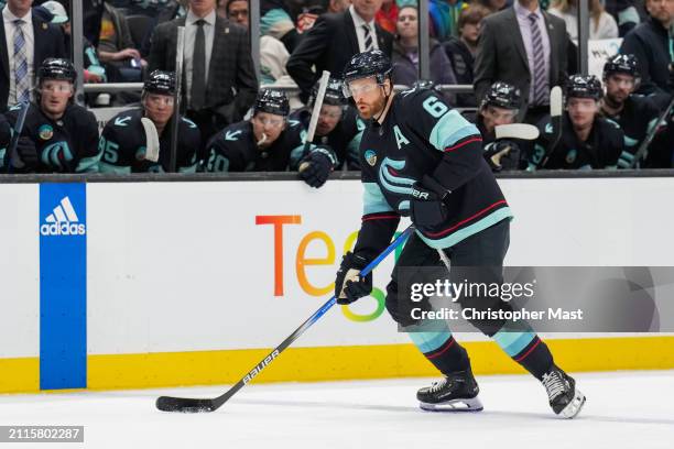 Adam Larsson of the Seattle Kraken skates with the puck at the blue line during the second period of a game against the Anaheim Ducks at Climate...