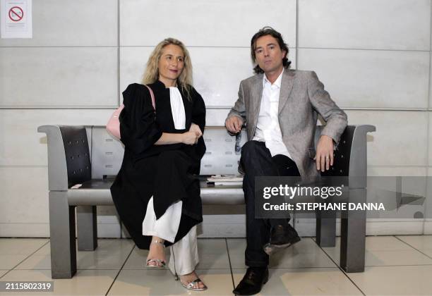 Defense's lawyers Melanie Junginder and Franck De Vita, wait for the beginning of the third day of the trial of their client, Mohammed M'Baerk,...