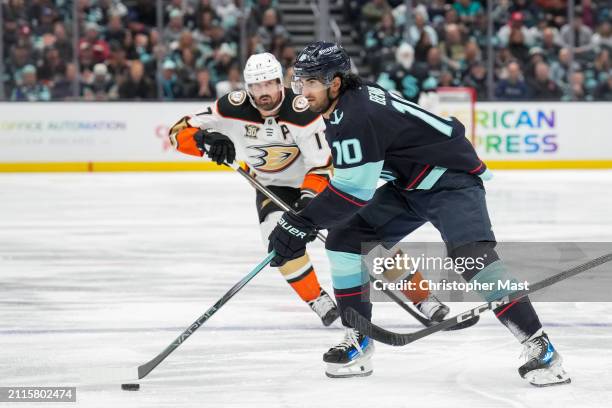 Matty Beniers of the Seattle Kraken skates the puck into the offensive zone during the third period of a game against the Anaheim Ducks at Climate...