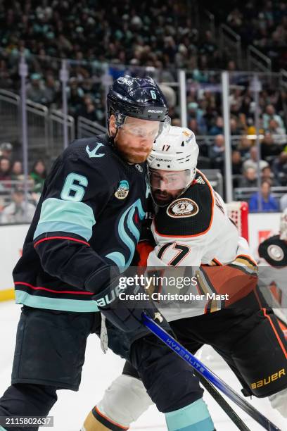 Adam Larsson of the Seattle Kraken and Alex Killorn of the Anaheim Ducks battle for the puck during the second period of a game at Climate Pledge...