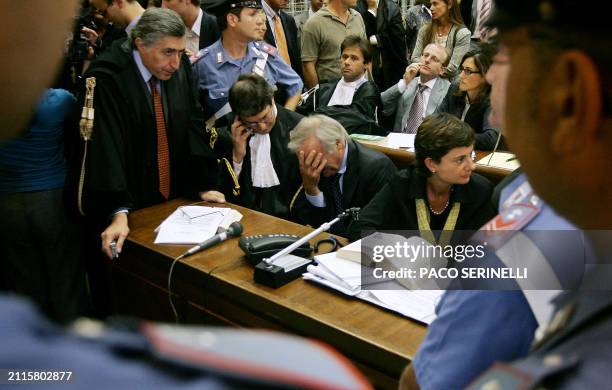 Calisto Tanzi , founder of Parmalat and his lawyers, Filippo Sgubbi and Fabio Belloni , wait at the Milan's courthouse, 28 september 2005. The former...