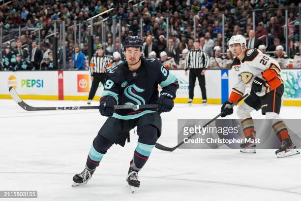 Logan Morrison of the Seattle Kraken looks for the puck in the corner against the Anaheim Ducks during the third period of a game at Climate Pledge...