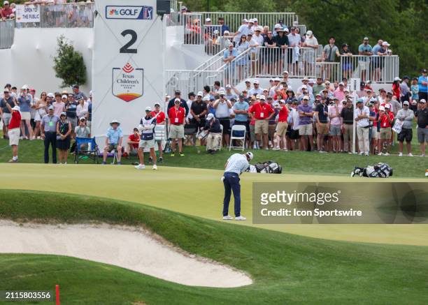 Long view of 2 green with Scottie Scheffler putting during Round 2 of the PGA Texas Children's Houston Open at Memorial Park Golf Course on March 29,...