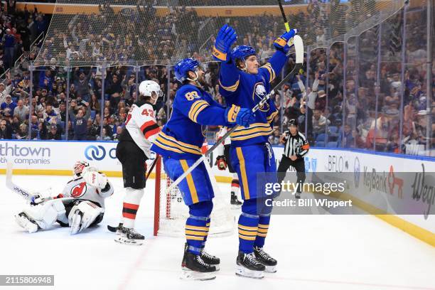 Tage Thompson of the Buffalo Sabres celebrates his third goal of the game against Jake Allen of the New Jersey Devils with Alex Tuch during an NHL...