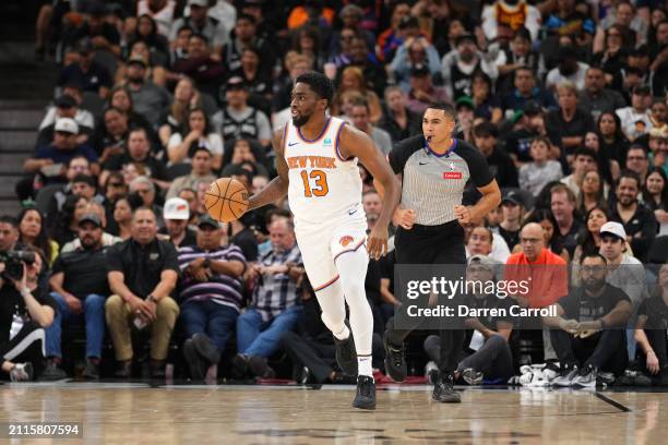 Shake Milton of the New York Knicks handles the ball during the game against the San Antonio Spurs on March 29, 2024 at the Frost Bank Center in San...