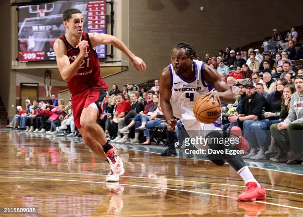 March 29: Deonte Burton of the Stockton Kings drives past Cole Swider of the Sioux Falls Skyforce during their game at the Sanford Pentagon on March...