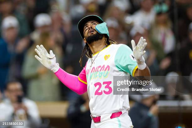 Fernando Tatis Jr. #23 of the San Diego Padres celebrates after hitting a solo home run in the eighth inning during a game against the San Francisco...