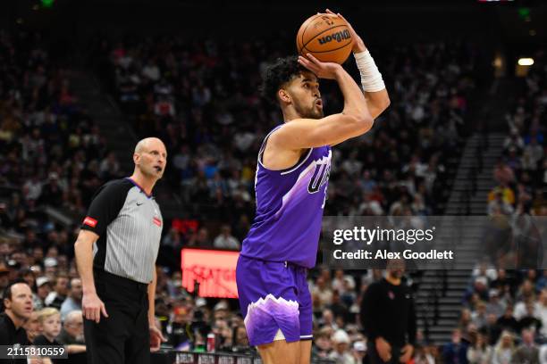 Johnny Juzang of the Utah Jazz shoots a three point shot during the second half of a game against the Houston Rocketsat Delta Center on March 29,...