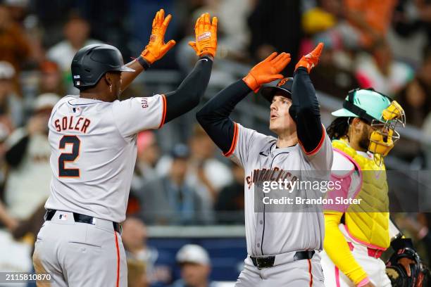 Matt Chapman of the San Francisco Giants celebrates with Jorge Soler after hitting a two-run home run in the ninth inning during a game against the...