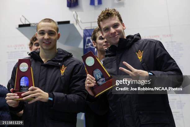 Ilya Kharun and Leon Marchand of Arizona State with teammates after a win in the Men 400 Yard Medley Relay and an NCAA record time of 2:57.32 during...