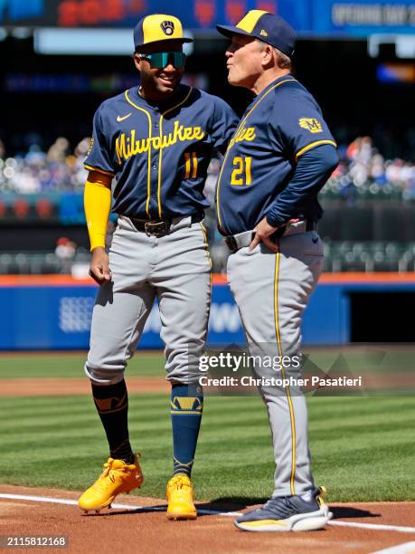 Jackson Chourio of the Milwaukee Brewers talks with manager Pat Murphy after being introduced for the game against the New York Mets at Citi Field on...